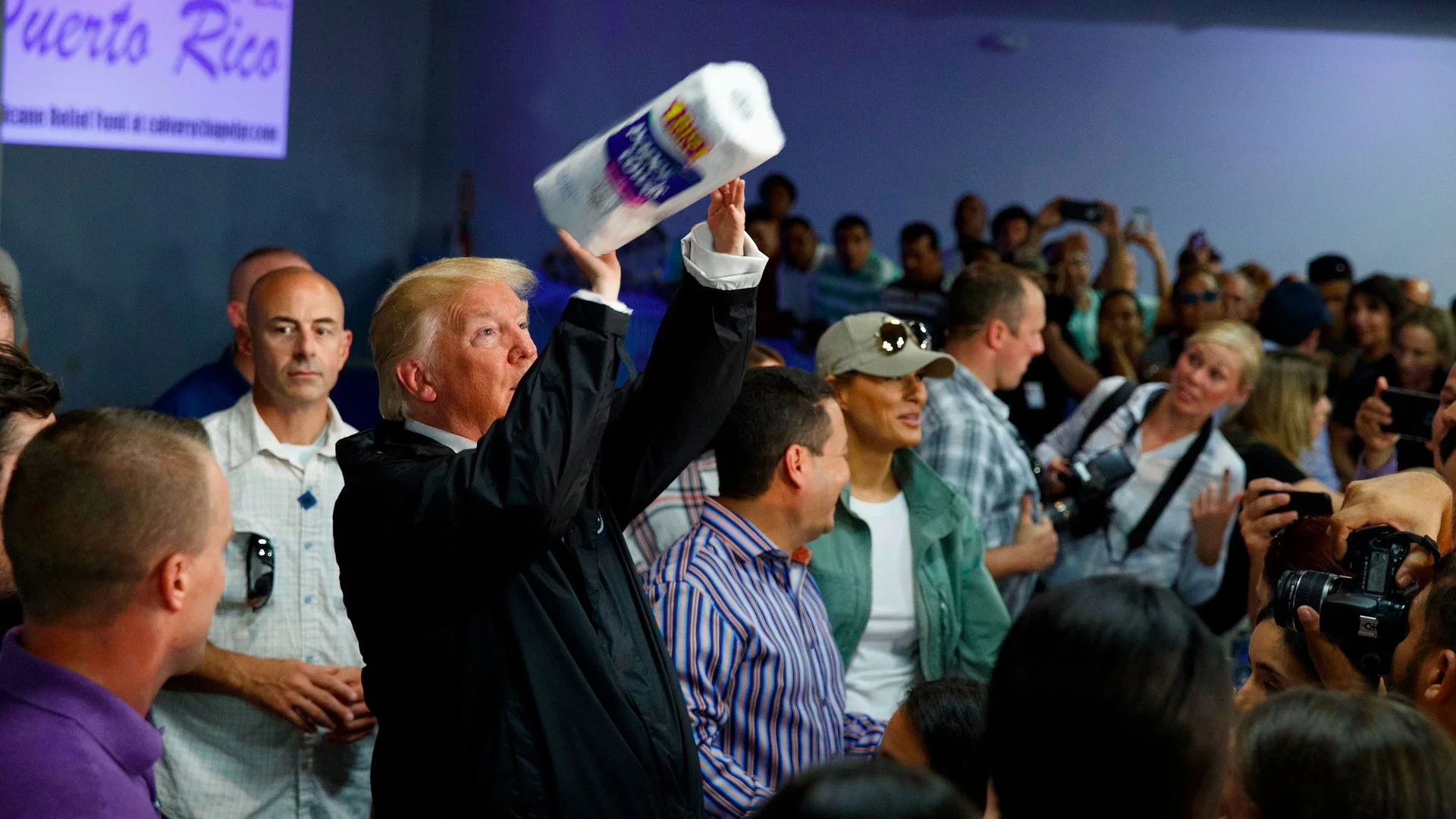 Donald Trump tosses paper towels into a crowd of Hurricane Maria survivors at Calvary Chapel in Guaynabo, Puerto Rico, October 3, 2017.