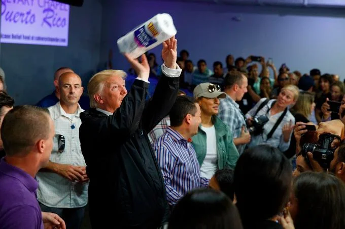 Another angle of Trump tossing paper towels to hurricane survivors during his October 2017 visit to Puerto Rico.