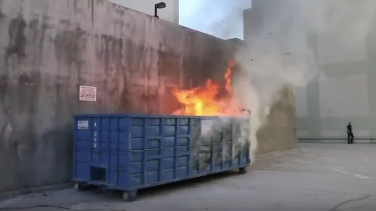 A literal dumpster fire, the visual origin of the popular idiom used to describe chaotic or disastrous situations.
