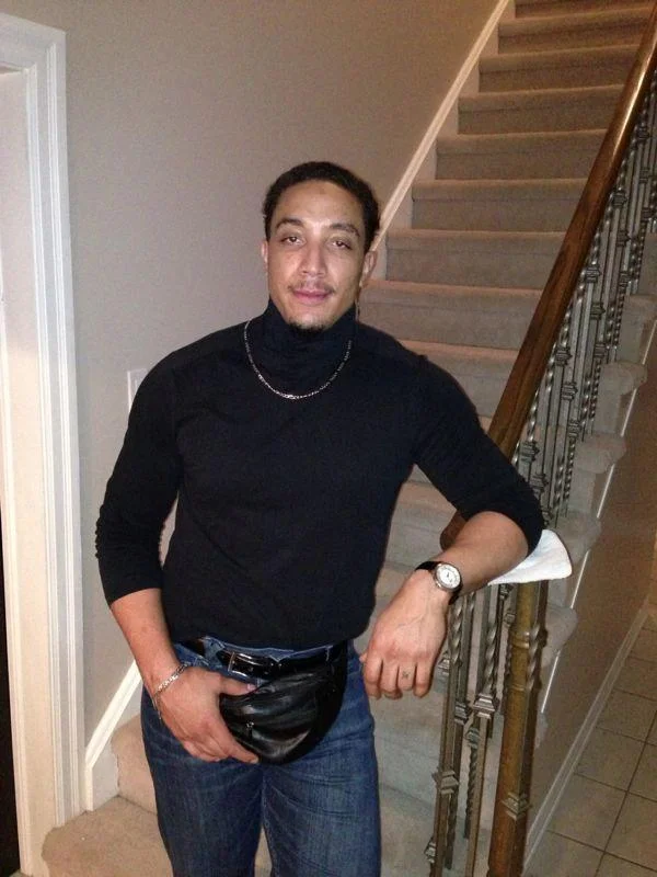 A fan-made recreation of Dwayne Johnson's famous 1990s pose, part of the viral cosplay trend inspired by the photo.