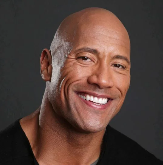 Dwayne 'The Rock' Johnson in a widely circulated promotional headshot used across the meme's know-your-meme entry.