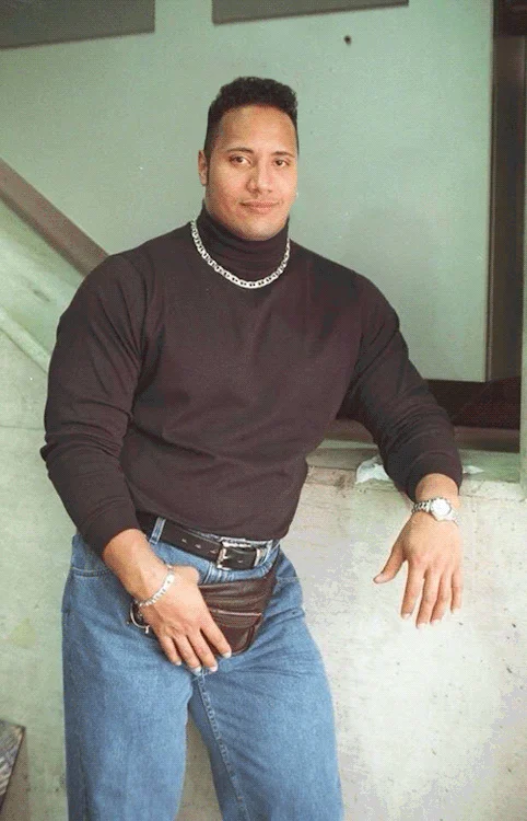 An animated GIF rendition of Dwayne Johnson's legendary 1990s turtleneck-and-fanny-pack photograph.