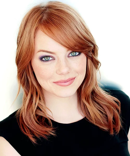 Actress Emma Stone, whose distinctive red hair, freckles, and expressive facial reactions have made her a popular subject of reaction GIFs and memes.