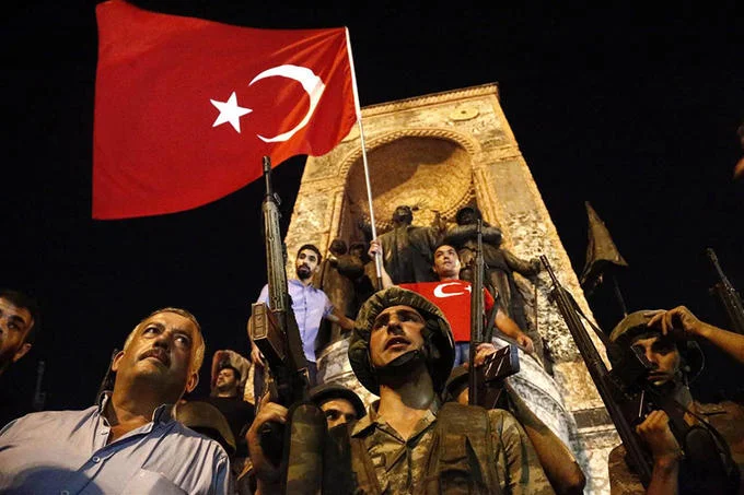 Civilians and troops gather in Istanbul's Taksim Square during the failed July 2016 coup attempt against Erdogan's government.