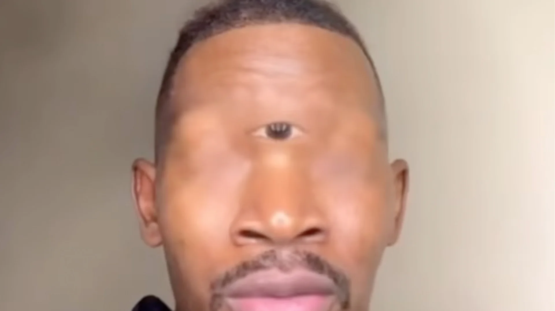 The original Eye of Rah TikTok frame, showing the creator with a photoshopped third eye placed between his brows.