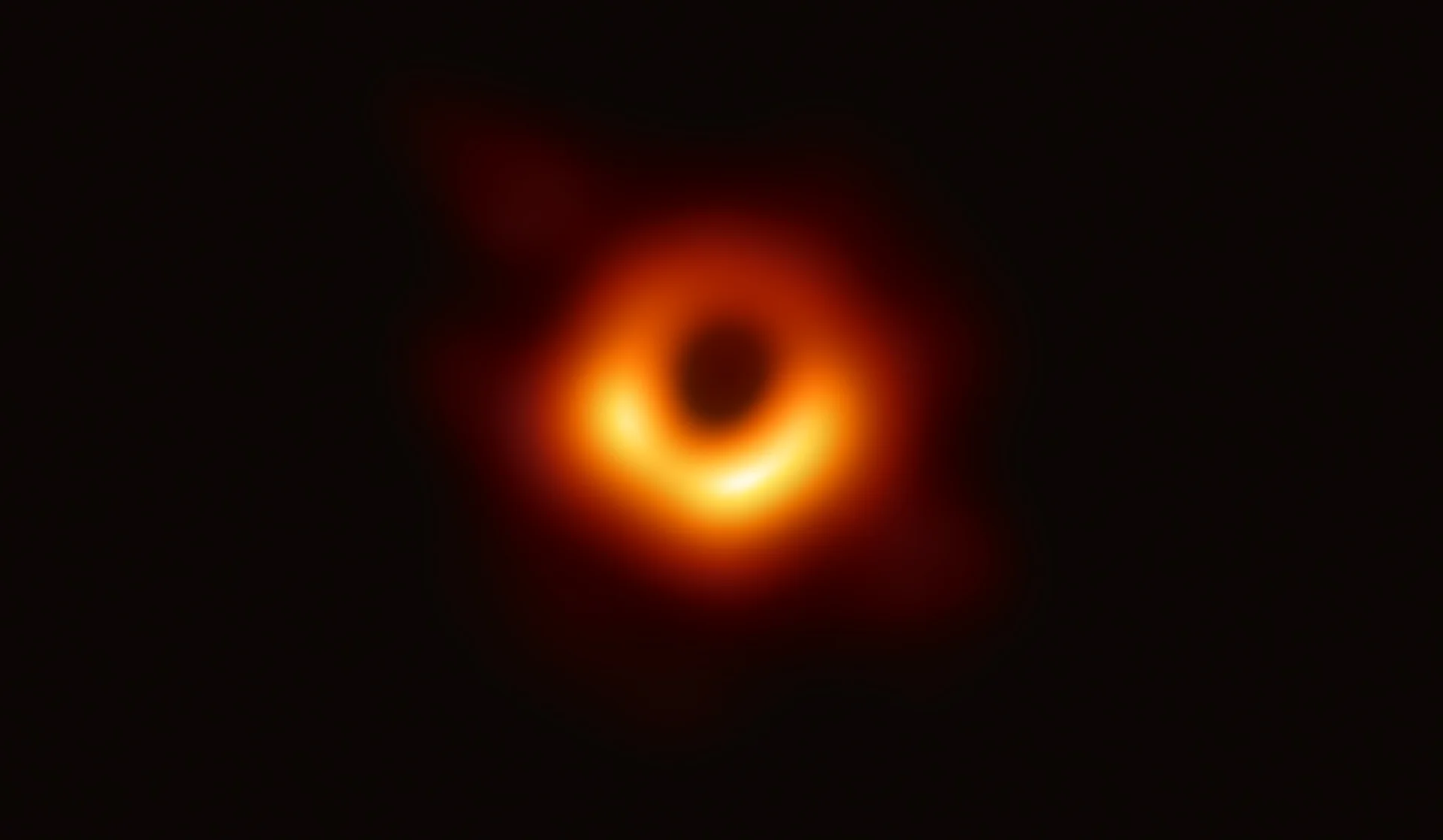 The Event Horizon Telescope's landmark 2019 image of the supermassive black hole in Messier 87, the source photograph that launched the meme.