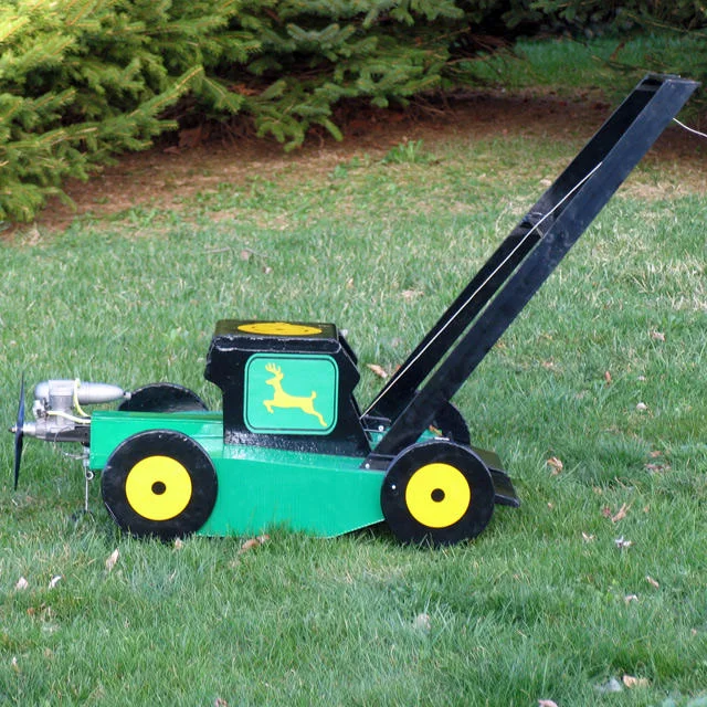 A hobbyist-built jet-powered model lawnmower referencing the Flying Lawnmower meme, complete with a launch ramp.