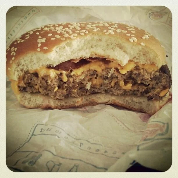 Intimate framing turning fast food into visually dramatic subject.