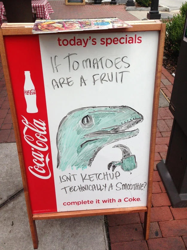 Restaurant A-frame signs often use absurd food logic and doodled mascots to draw laughs from passersby.