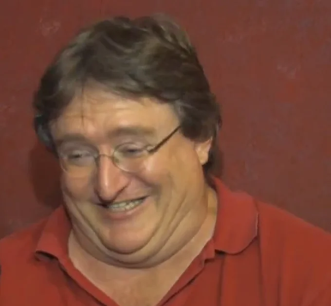 Gabe Newell laughs during a video interview, a still frequently used as a reaction image in gaming communities.
