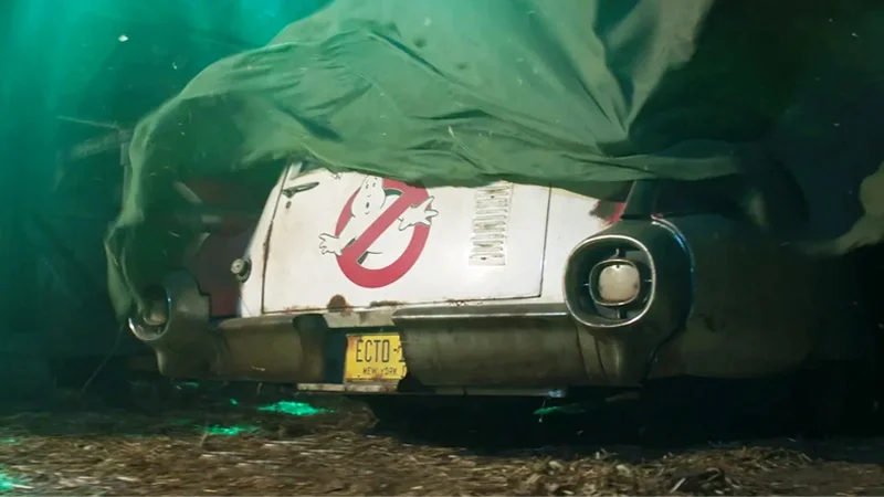 Still from the 2019 teaser for Jason Reitman's Ghostbusters: Afterlife, revealing the abandoned Ecto-1 in a barn.
