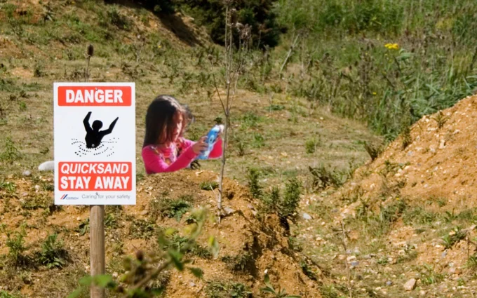 Quicksand warning sign edit.