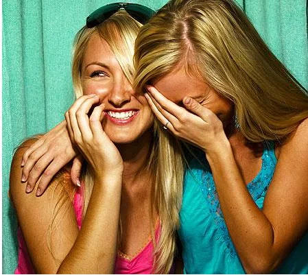 The iconic 'Girls Laughing' stock photo commonly used as the meme's main image.