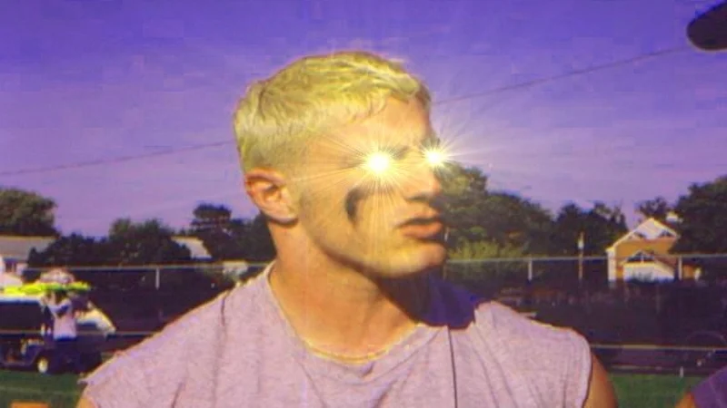 The primary entry image for the Glowing Eyes / Laser Eyes meme, showing a figure whose eyes emit intense beams of light.