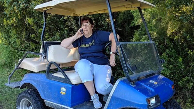 The viral photograph of 'Golf Cart Gail' calling police from her golf cart during a youth soccer game in Florida.