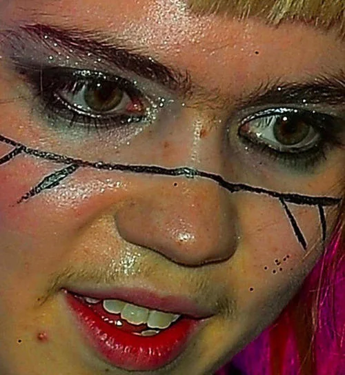 A close-up of Grimes in one of her signature glitter-and-face-paint looks.