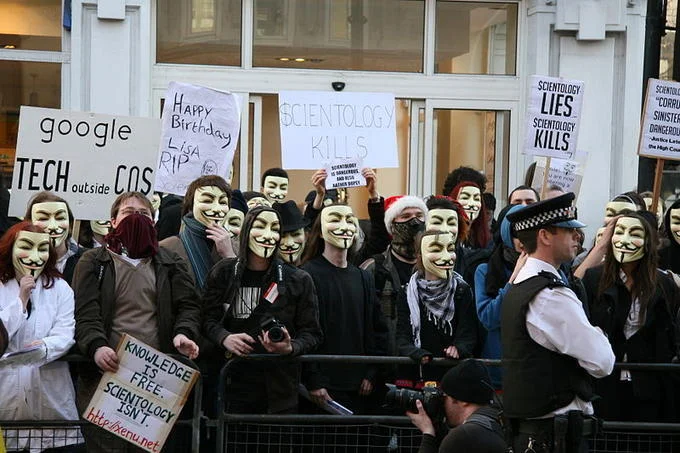 Members of Anonymous wearing Guy Fawkes masks during a Project Chanology protest against the Church of Scientology.