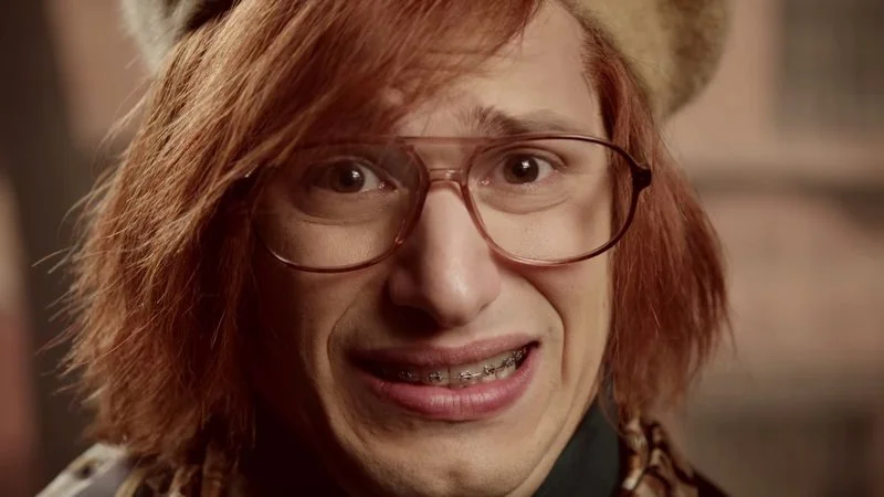 Andy Samberg's iconic cringe expression.