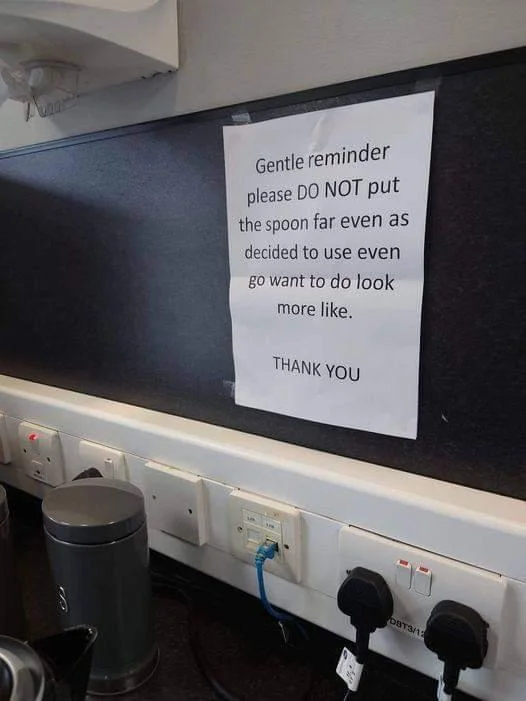 A real-world office kitchen sign humorously incorporating the meme's garbled syntax into a workplace notice.
