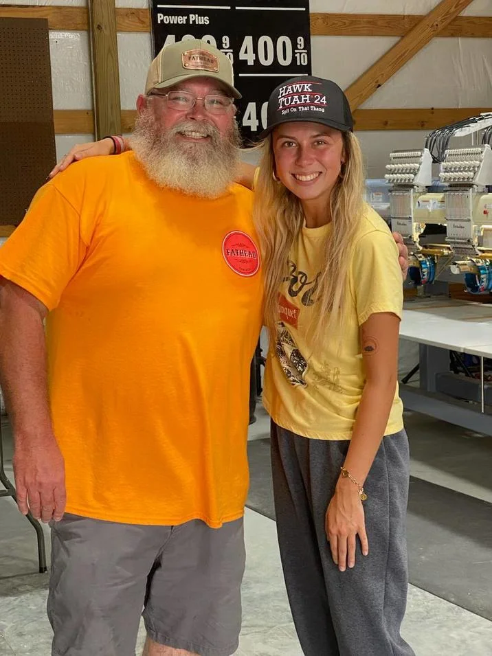 Hailey Welch visits the shop producing her 'Hawk Tuah 24 - Spit On That Thang' branded hats.