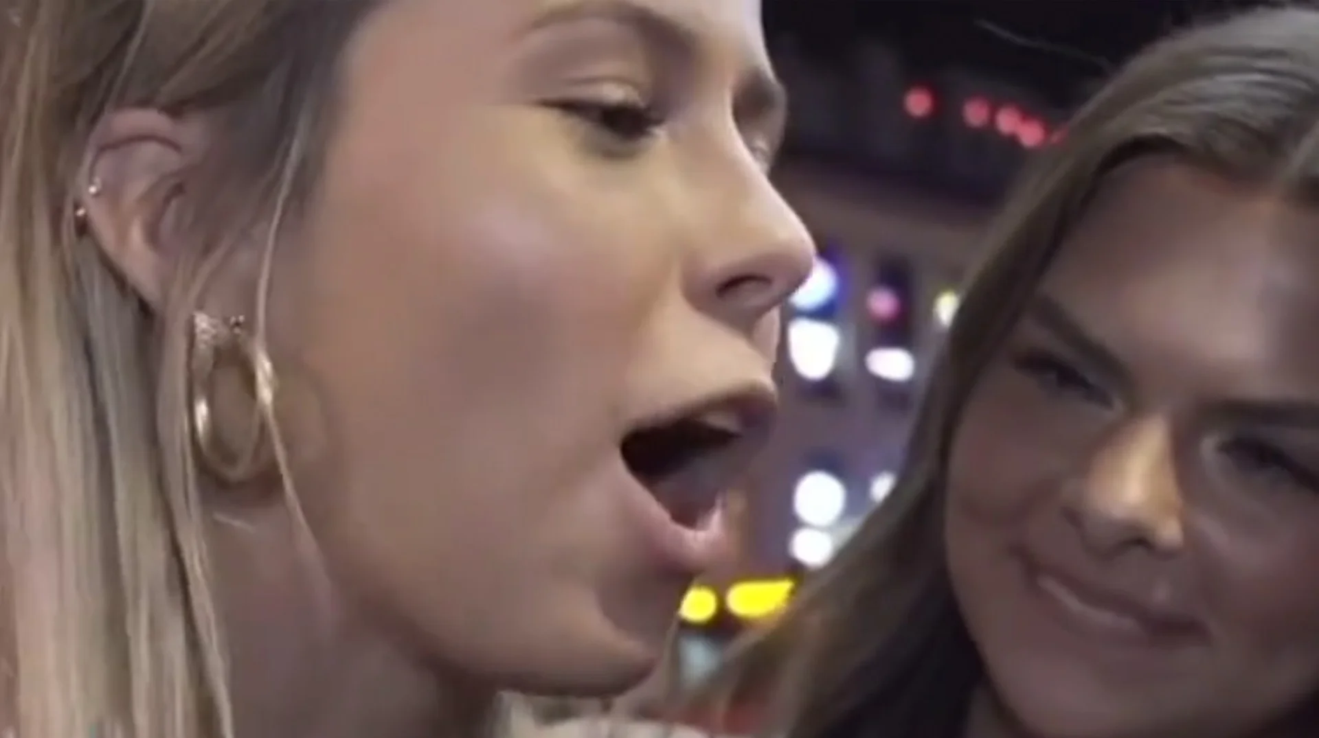 The iconic moment from the June 2024 street interview in Nashville that spawned the 'Hawk Tuah' meme.