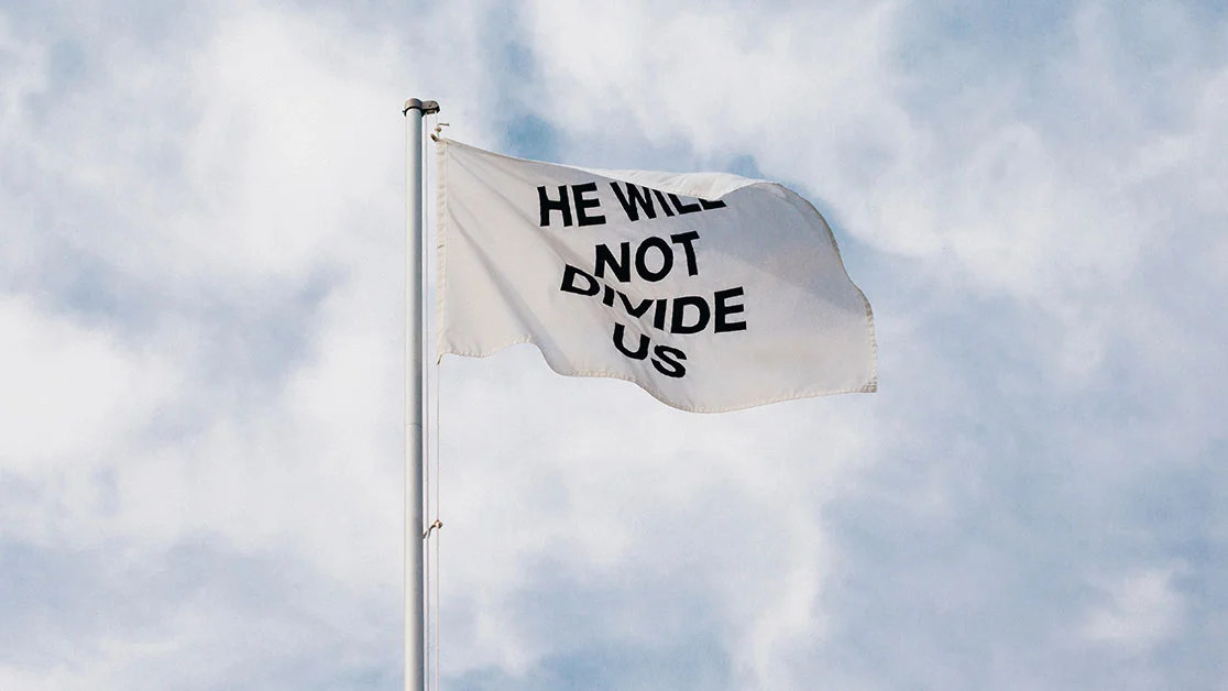 The 'He Will Not Divide Us' flag, the central artifact of Shia LaBeouf's anti-Trump livestream art project.