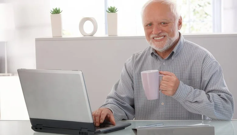 The iconic Hide the Pain Harold stock photo that defined the meme.