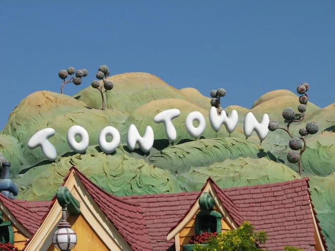 Disneyland's Mickey's Toontown features a cartoon-styled parody of the Hollywood sign spelling out 'TOONTOWN.'