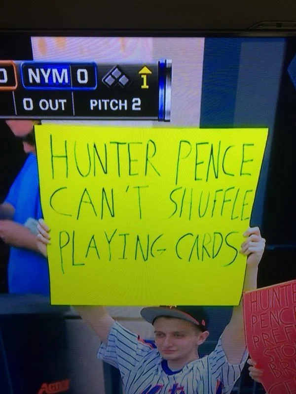 Stadium broadcast capturing children participating in meme trend.