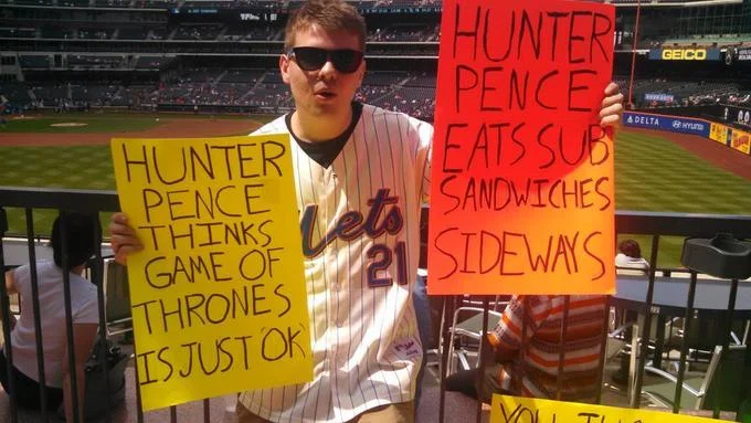 Multiple creative Hunter Pence Signs at original Mets venue.