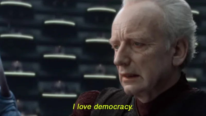 The original scene from Star Wars: Attack of the Clones (2002) where Senator Palpatine delivers the line 'I love democracy,' which became the basis for the meme.