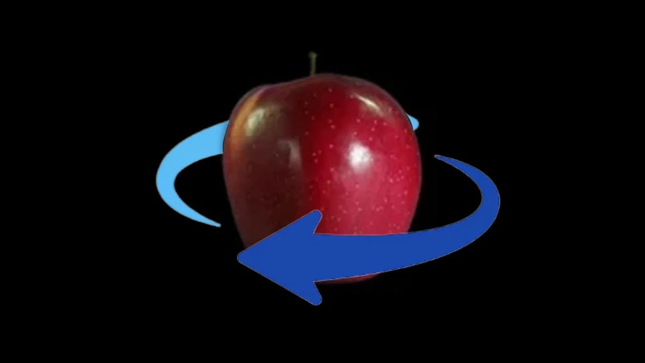 Cover image for the 'Imagine Spinning Apples' meme, depicting a red apple with directional arrows representing the mental rotation exercise used to illustrate aphantasia.