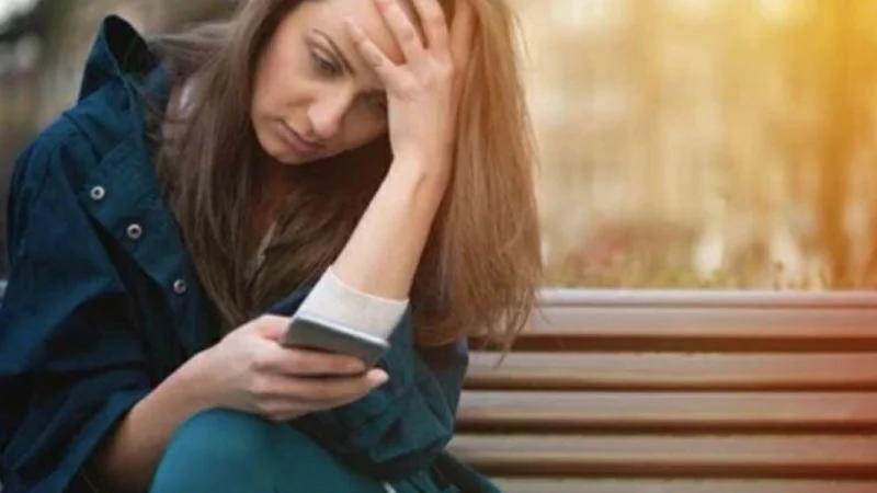 The original stock photograph of a concerned mother staring at her phone that anchors every 'Is Your Child Texting About' variation.