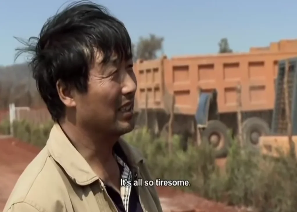 The original 'It's All So Tiresome' screenshot taken from a documentary about Chinese workers in Africa.