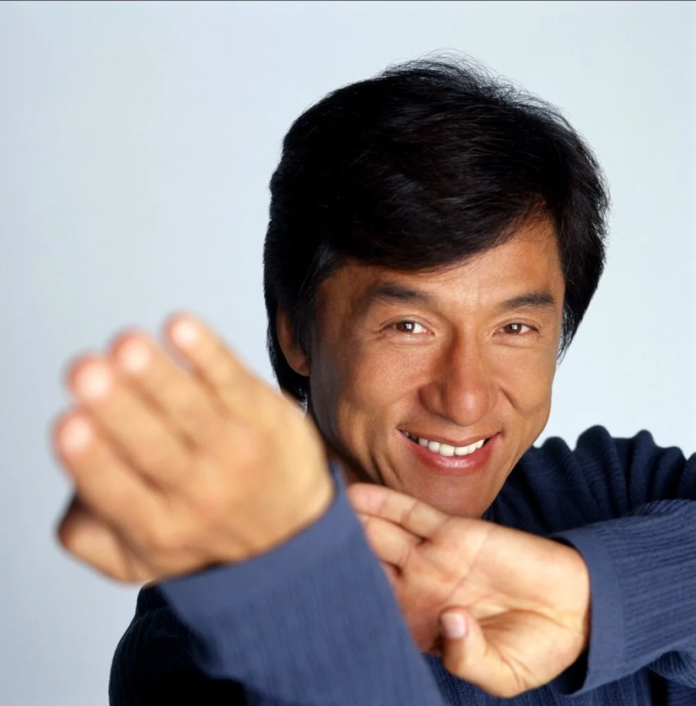 Jackie Chan in a signature martial arts pose, one of the actor's most widely recognized promotional portraits.