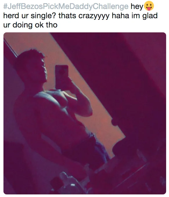 A shirtless mirror-selfie entry to the #JeffBezosPickMeDaddyChallenge, parodying flirty DM approaches to the newly-single Bezos.