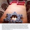 Beer pong game setup on a wooden table.