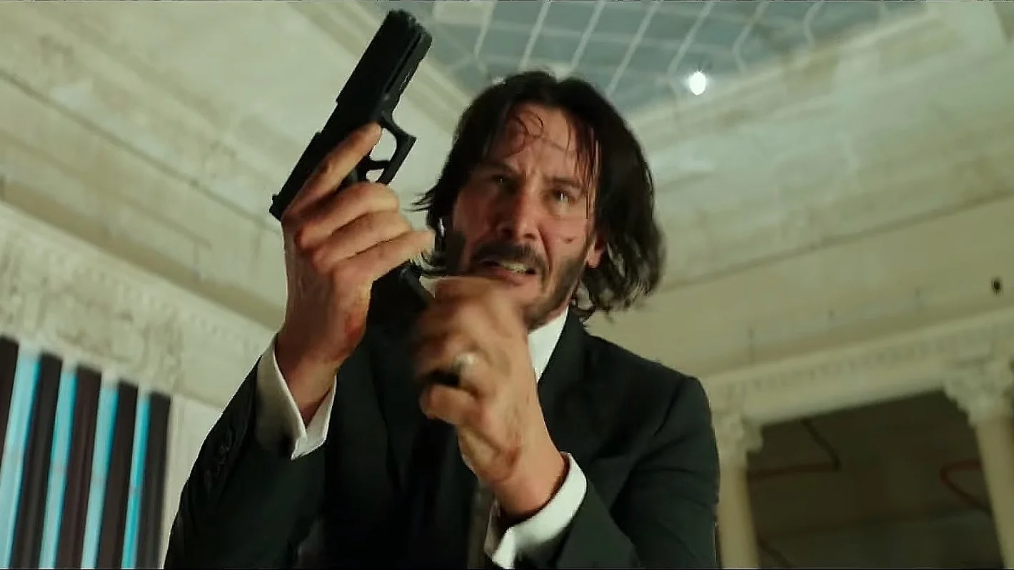 The original John Wick reloading scene still that became the template for the reaction meme.
