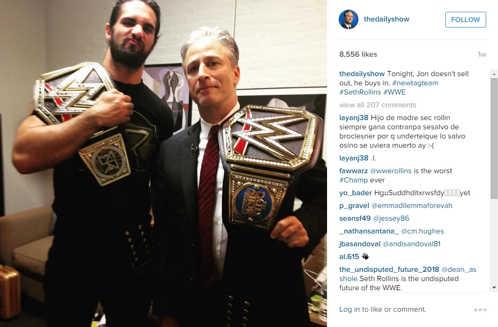 Jon Stewart poses backstage with WWE Champion Seth Rollins, shared on The Daily Show's Instagram.