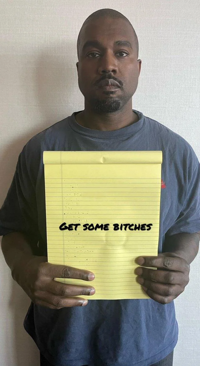 Kanye West Holding Notepad