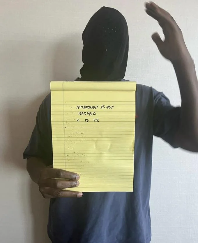 Kanye West Holding Notepad