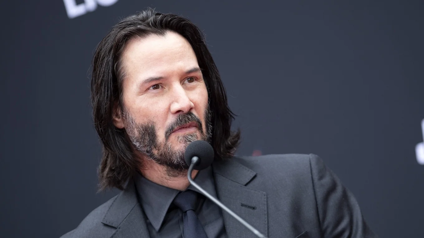 Keanu Reeves at a public press event, the actor whose universally beloved public persona spawned countless internet memes.