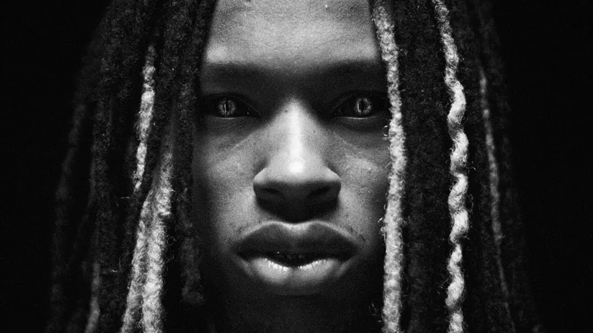 The original close-up shot of King Von that became the basis for the 'anti-piracy screen' stare meme.