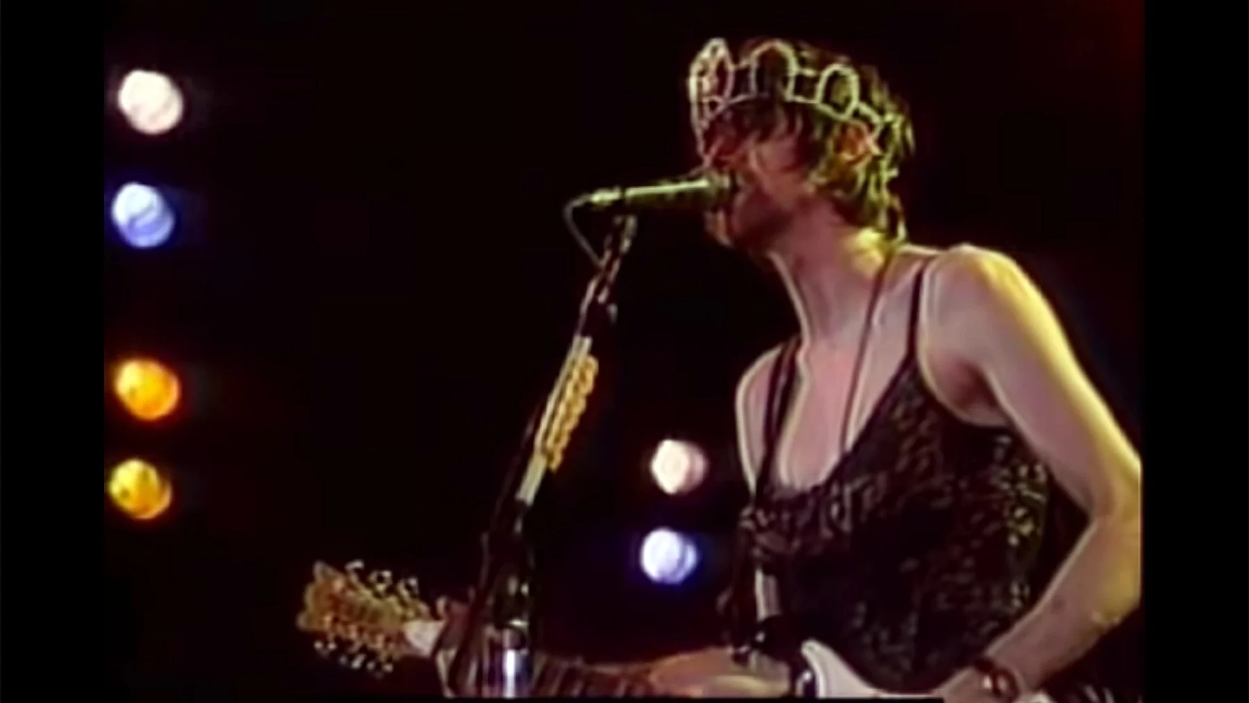 Kurt Cobain performing in a dress on stage, one of the frequently cited images in the debate over whether Cobain was trans.