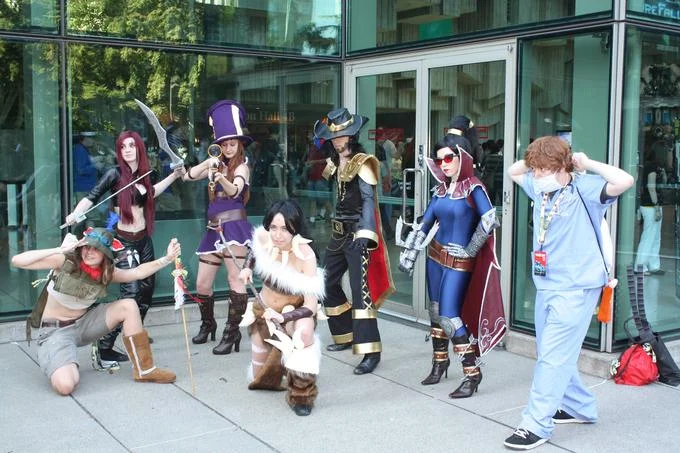 Fans dressed as League of Legends champions at a gaming convention.