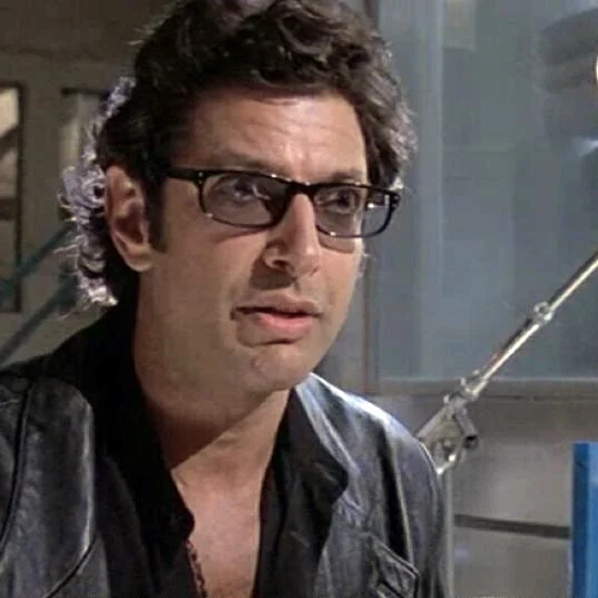 Dr. Ian Malcolm (Jeff Goldblum) delivers the iconic 'life, uh, finds a way' line in Jurassic Park (1993).