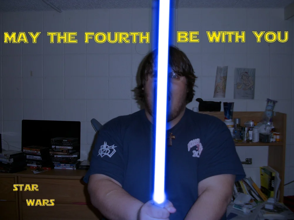 Cropped close-up of the anime schoolboy channeling his inner Jedi with a lightsaber.