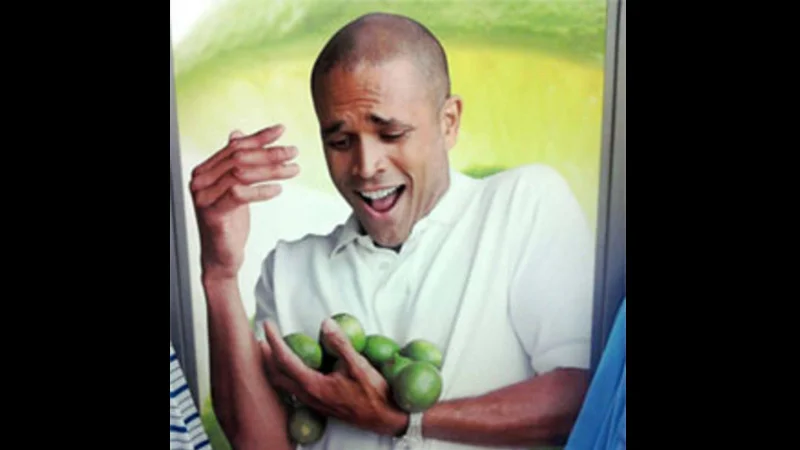 The original 'Limes Guy' image that spawned the 'Why can't I hold all these limes?' meme, cropped from a George clothing brand advertisement.