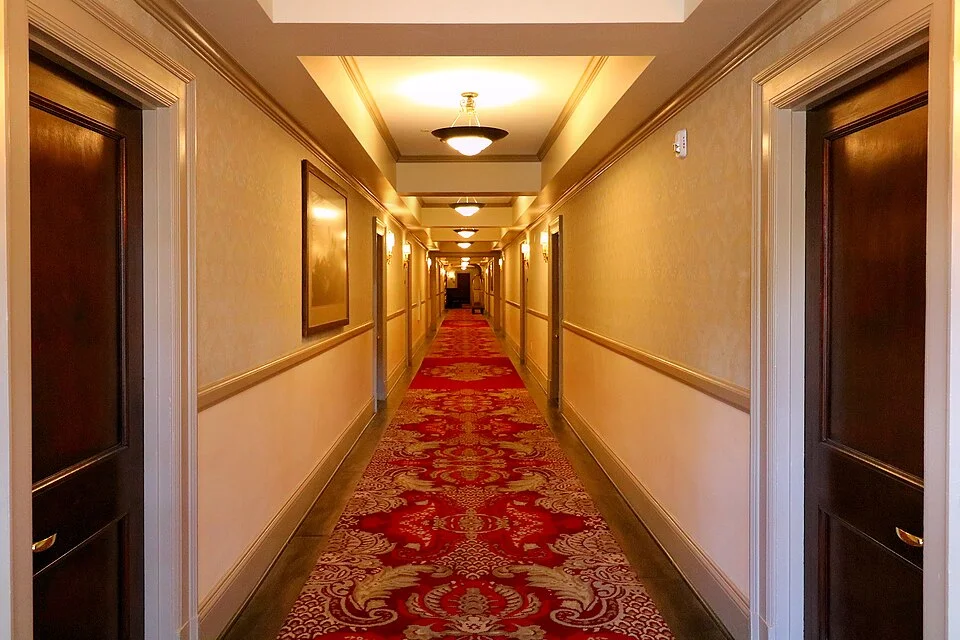Archetypal liminal space hallway evoking nostalgia and unease.