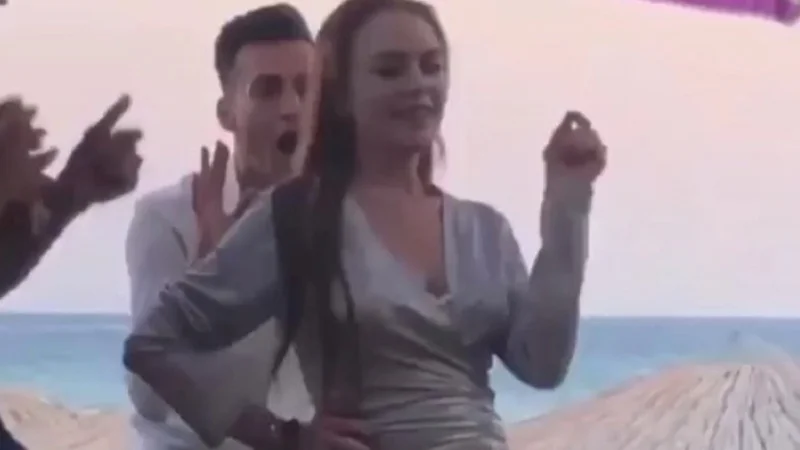 Screenshot from the viral 2018 video of Lindsay Lohan dancing at her Mykonos beach club, which became the basis of the 'Lindsay Lohan Beach House Dance' meme.